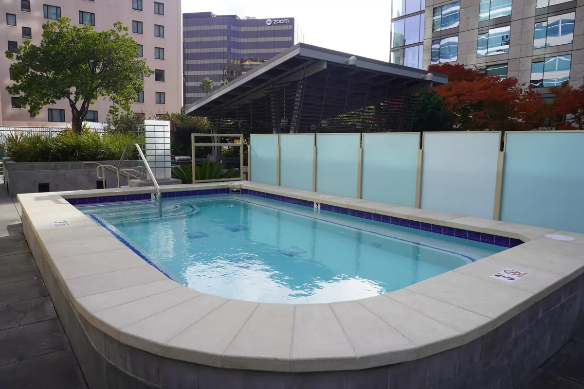 A raised spa with clear water.